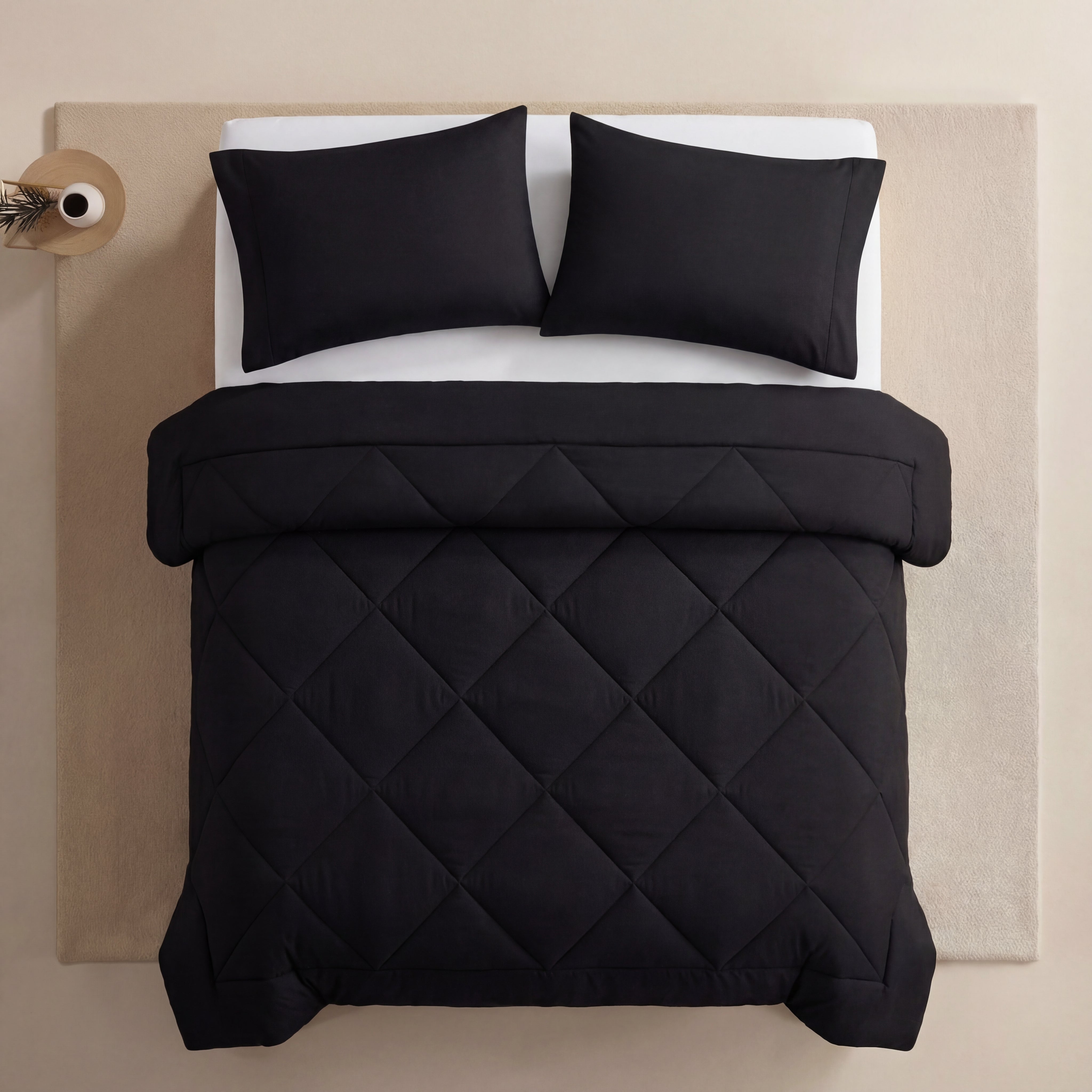 Midnight Black EasySleep blanket showing its diamond quilting and turned-down finished edge