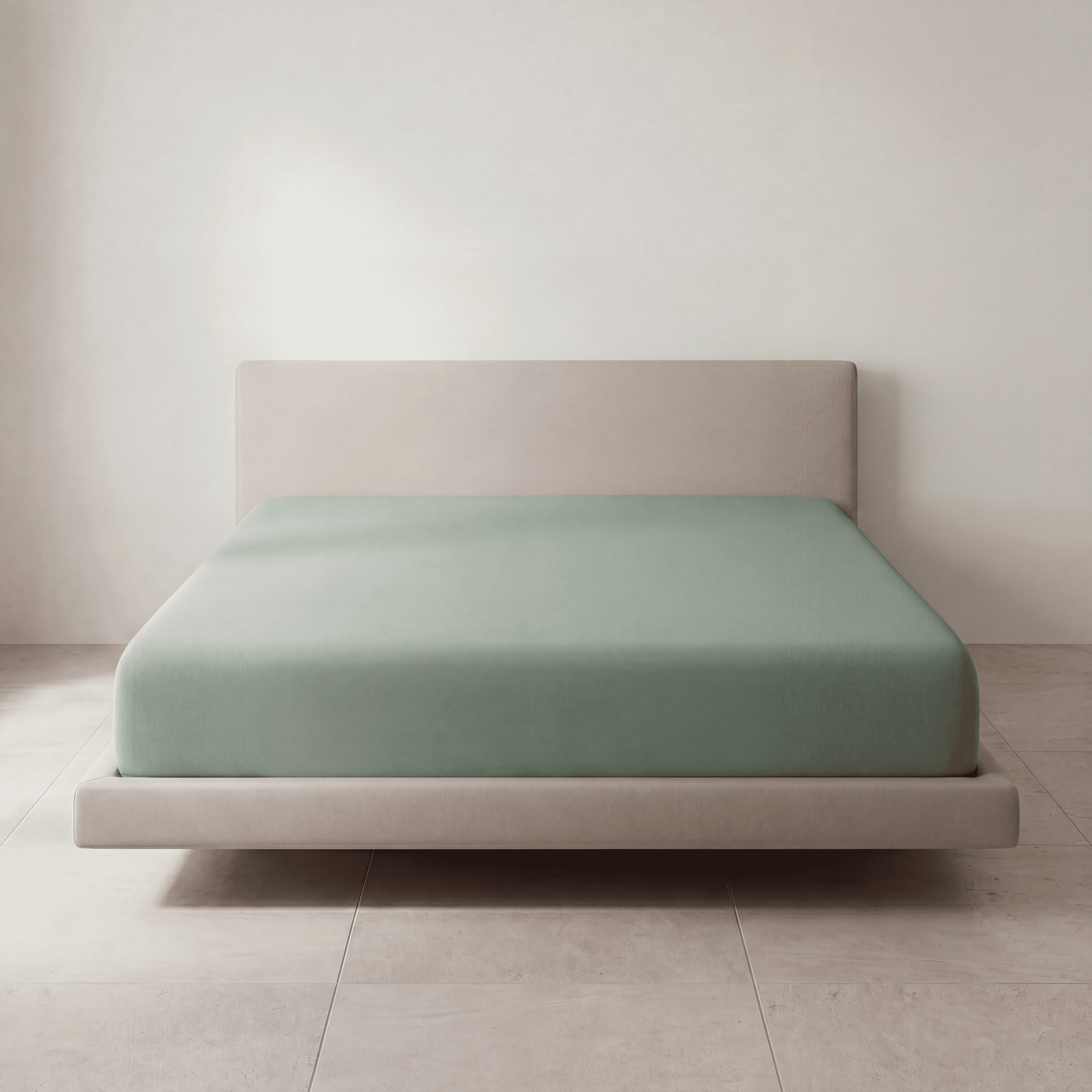 Soft Mint Green fitted sheet on a full upholstered bed