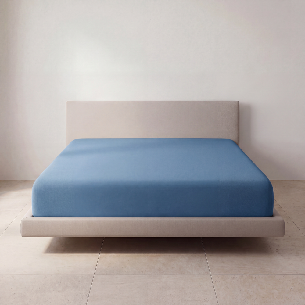 Coastal Blue SoftCloud sheet on a full upholstered bed