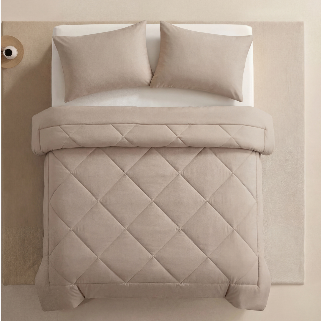 Cream Beige EasySleep blanket with its quilted outer finish on a neutral bed