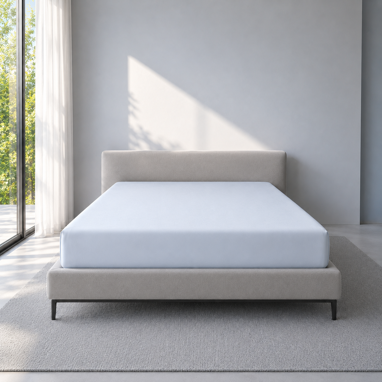 Frozen Blue IceCloud fitted sheet in an airy bedroom, with the full mattress and fitted corners visible